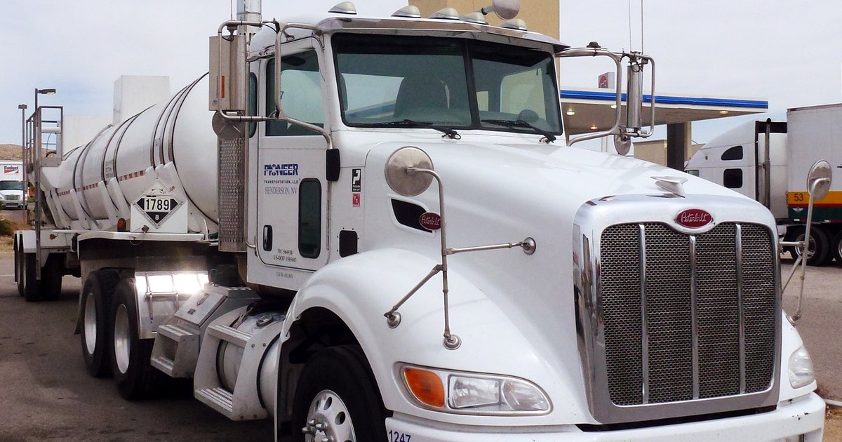 A Peterbilt semi-truck close-up at a U.S. fuel plaza